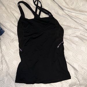Lululemon black yoga top with see through detailing on sides and back